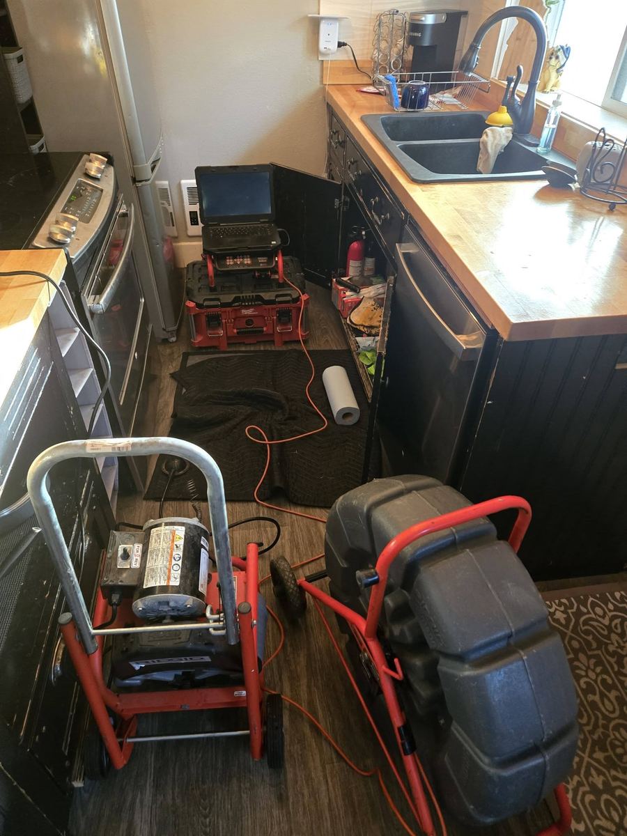 Drain Coeur drain-cleaning equipment staged on an interior job in North Idaho